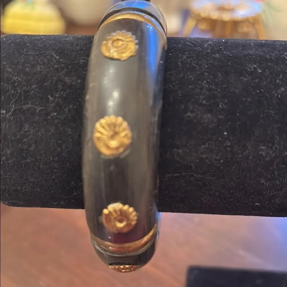 Black and Gold Bracelet with Unique Embedded Flowers